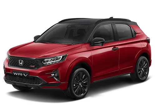 Mobil Honda WR-V berwarna merah cerah diparkir di luar ruangan.