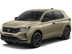 Mobil Honda WR-V berwarna Sand Khaki metallic, tampak depan-samping, diparkir di luar ruangan.